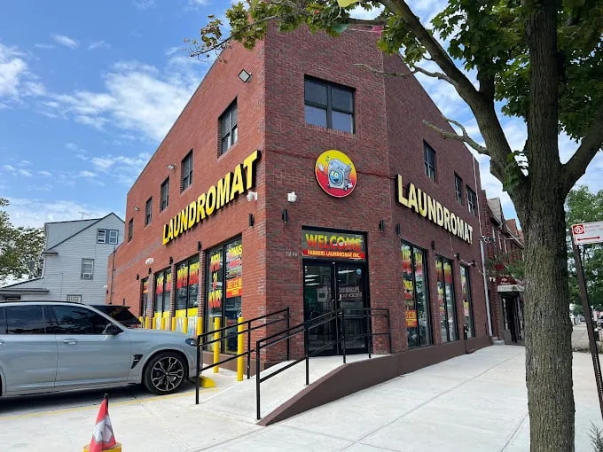 Farmers Laundromat's brick corner building with LAUNDROMAT signage on two sides